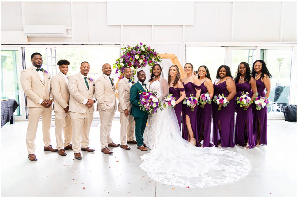 This is a picture of their wedding party, with the groomsmen on the left and the bridesmaids on the right. 